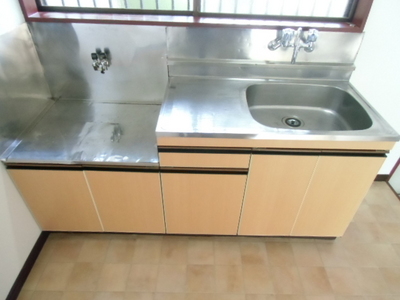 Kitchen. 2 lot gas stoves, There is also a cutting board space.