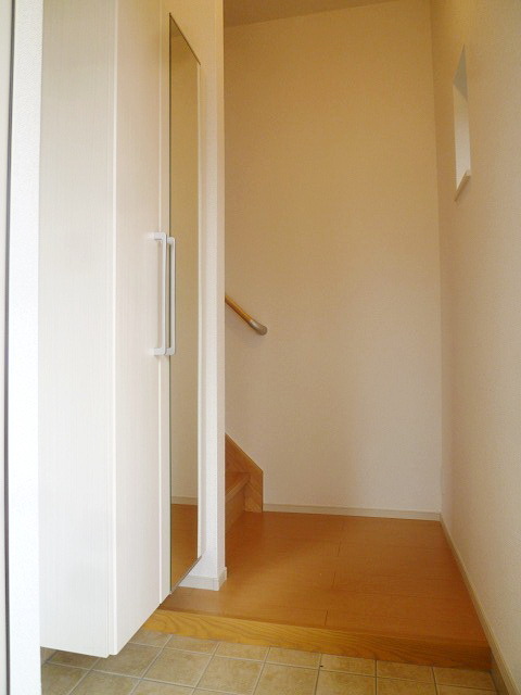 Entrance. There is a window in the front door