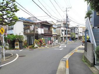 Local photos, including front road. Front road with a sidewalk