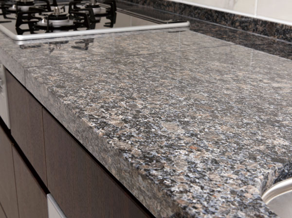 Kitchen.  [Natural stone counter] The kitchen counter top board, Adopted a profound sense of granite. To produce a kitchen with a sense of quality.  ※ There is a joint in the top plate, It has been made the seal processing.
