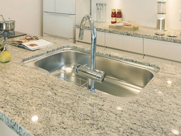 Kitchen.  [Granite top plate] Top plate of the kitchen, Feeling of luxury granite. I was directing the spread in space by integrally molding the top plate and the counter.