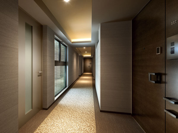 Shared facilities.  [Each material with enhanced quality is by design] The one and mansion feeling to every single material that buildings wear manifests itself vividly, Mansion serving as breath and life force will continue tinged by design. While each material is based on the ground color, Granite to produce a marble and solid impression, By combining the tile woodgrain to give a three-dimensional sense of texture, It has extended synergistically quality of. (Corridor Rendering CG)