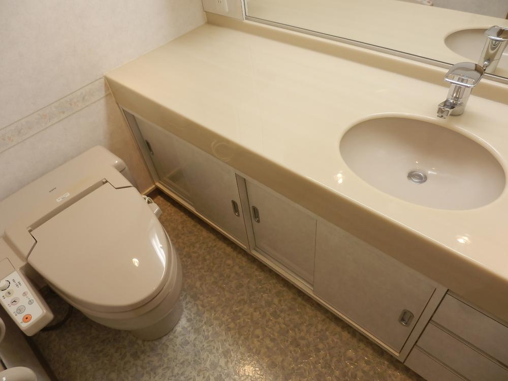 Toilet. There is spacious powder room