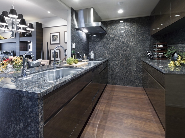Kitchen which adopted the natural stone counter top is beautiful glossy finish, Cup boards have been installed