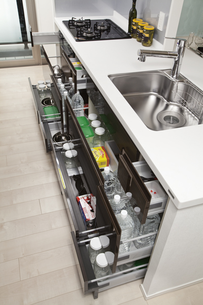 Kitchen.  [Sliding storage] Storage of system kitchens, It can be effectively utilized in the prone cabinet in a dead space, It has adopted a sliding storage. Also, Installing a sliding storage until the space of feet. Season of the cooking tools and stock goods also easy to remove, Amount of storage was also secured. The other to set up a kitchen knife pocket and spice rack, etc. also.