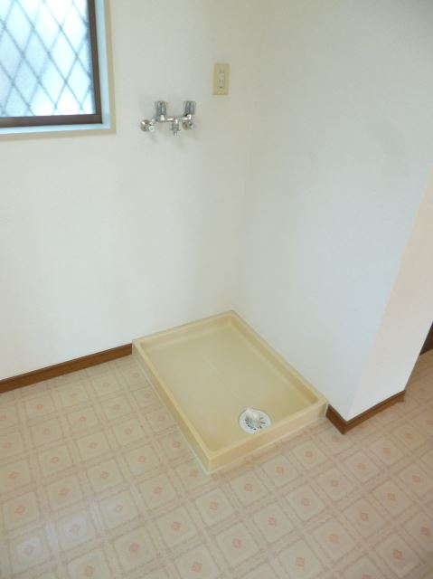 Other room space. Washing machine in the room