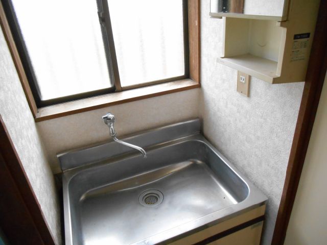 Washroom. Also it has a wash basin in the dressing room