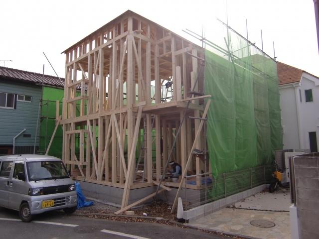 Local appearance photo. Since facing the broad public roads, Car out is also safe. North-west side adjacent land passage. 