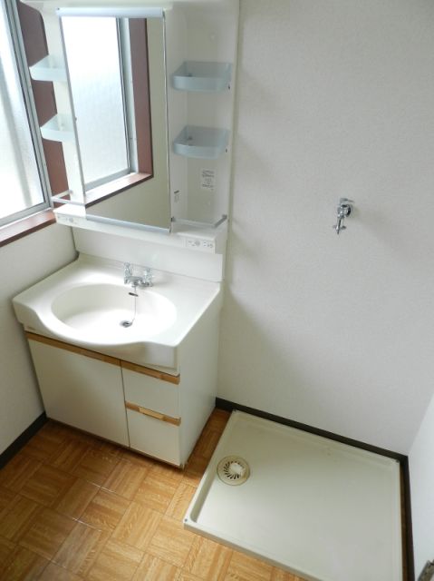 Washroom. It is bright and there is a window in the dressing room