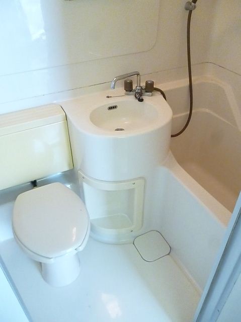 Bath. Unit is a bus that was based on white.