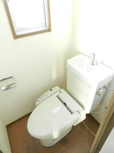 Toilet. It is a window with a toilet