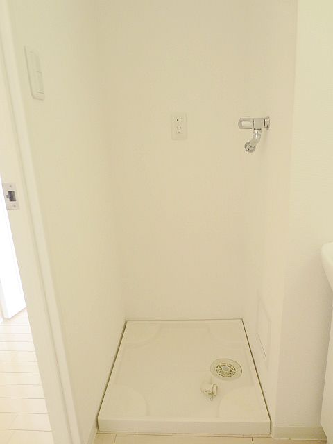 Other room space. Washing machine in the room