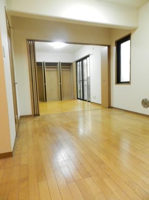 Living and room. All is the flooring of the room