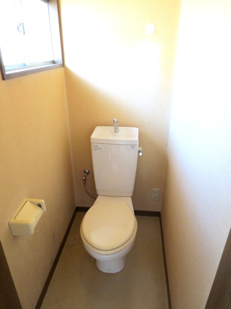 Toilet. There is a window in the toilet