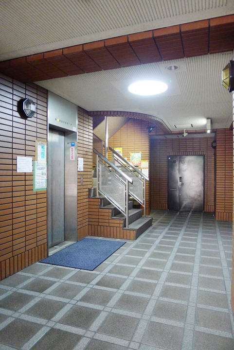 Entrance. Lobby full of profound feeling of tile and stainless steel.