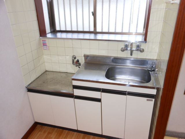 Kitchen. Bright and there is a window kitchen