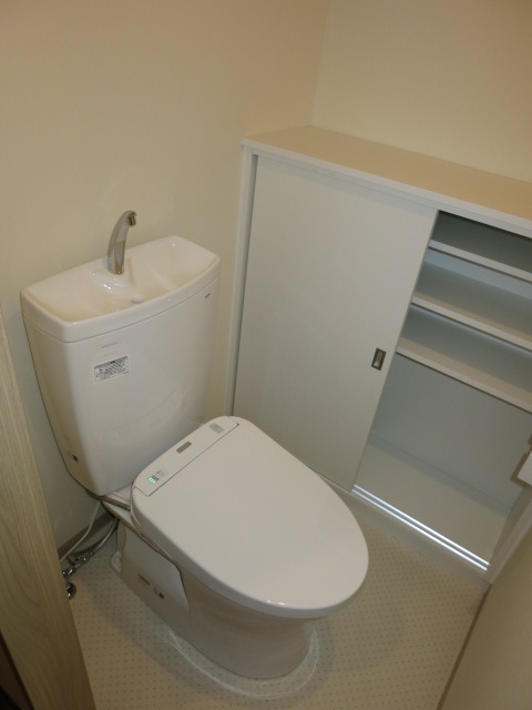 Toilet. It is a toilet seat with warm water washing function. 