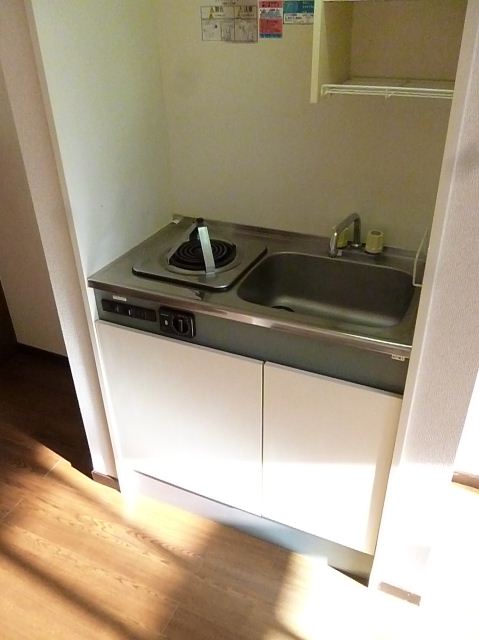 Living and room. 1-neck is electric stove marked with kitchen. 