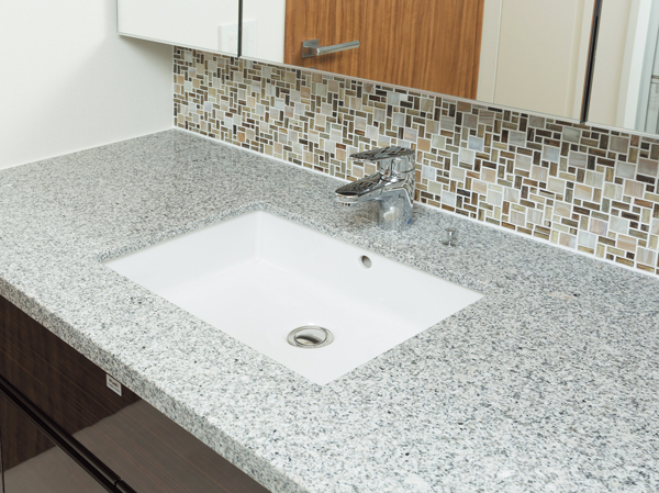Bathing-wash room.  [Vanity natural stone top plate] We nestled the texture rich natural stone in the bathroom vanity counter top board.