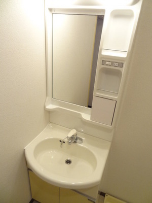 Washroom. There is a washing machine yard and wash basin in vanity dressing room. 