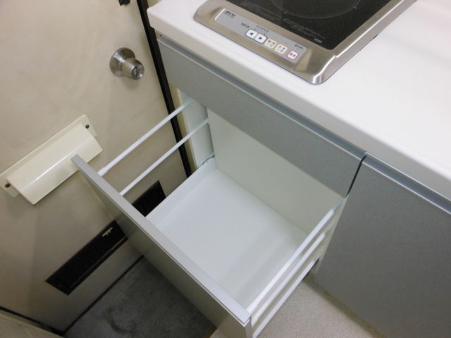 Kitchen. Convenient pull-out type of storage space