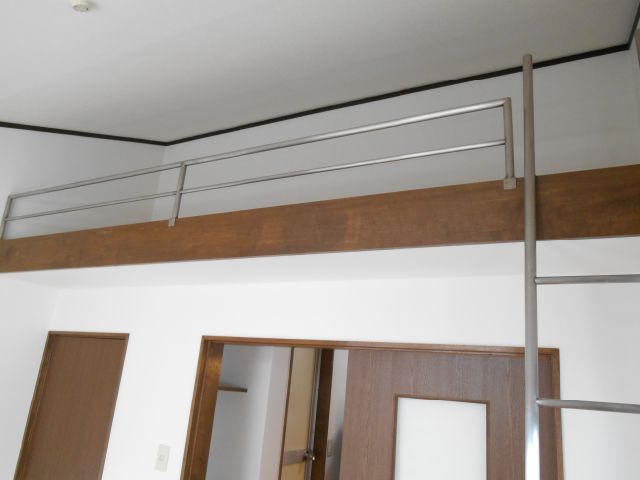 Living and room. It is a loft with a room