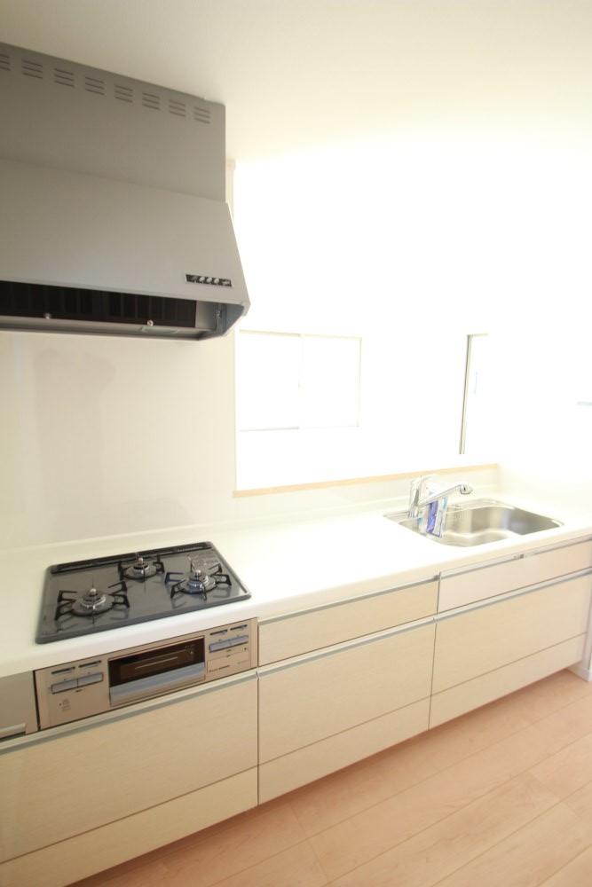 Kitchen. While talking with family members is a counter kitchen set up in the kitchen.
