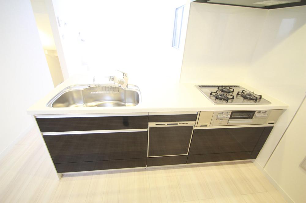 Kitchen. Cupboard space is also taken to spread.