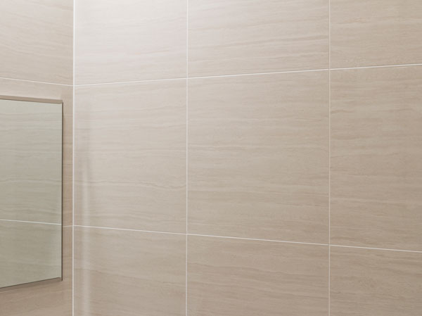 Bathing-wash room.  [Feeling of luxury bathroom tile] The floor has adopted the tile of 300mm angle to produce a feeling of luxury. Adopt a large tile of beautiful 400mm angle to look on the wall. Dirt have been made difficult super-clean joint that attaches.