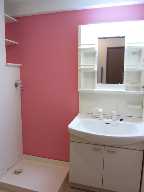 Washroom. While small in the washroom there is a shelf