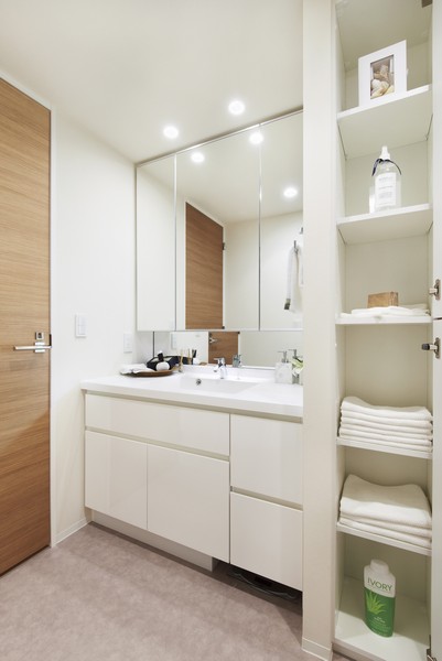 Wash room where storage space, such as "linen warehouse" was rich