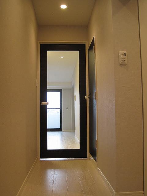 Entrance. Unusual glass-walled living room door