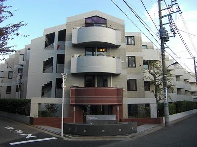 Local appearance photo.  [appearance] Low-rise apartment with a courtyard nestled in a quiet residential area