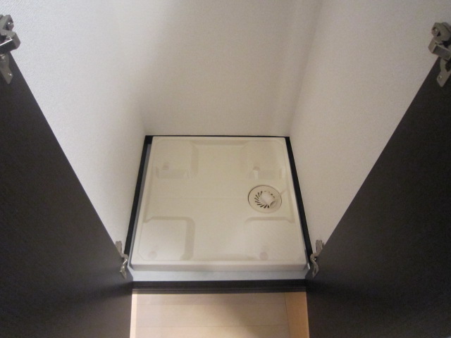 Other Equipment. The washing machine storage is equipped with a door.