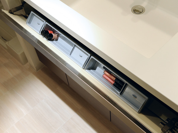Bathing-wash room.  [Bowl under the Cosmetics storage pockets] Installing a pocket that opens to the front under the sink bowl. It is perfect for storage of make-up supplies.