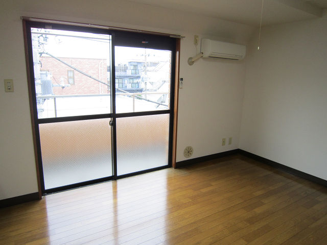 Living and room. It is a photograph of another room