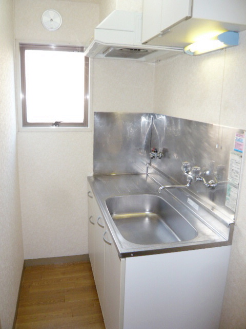 Kitchen. No window, It is a separate room photo of the same type.