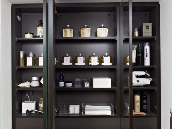 Bathing-wash room.  [Three-sided mirror back storage] Adjustable shelves housing the tissue box was secured just fits depth.