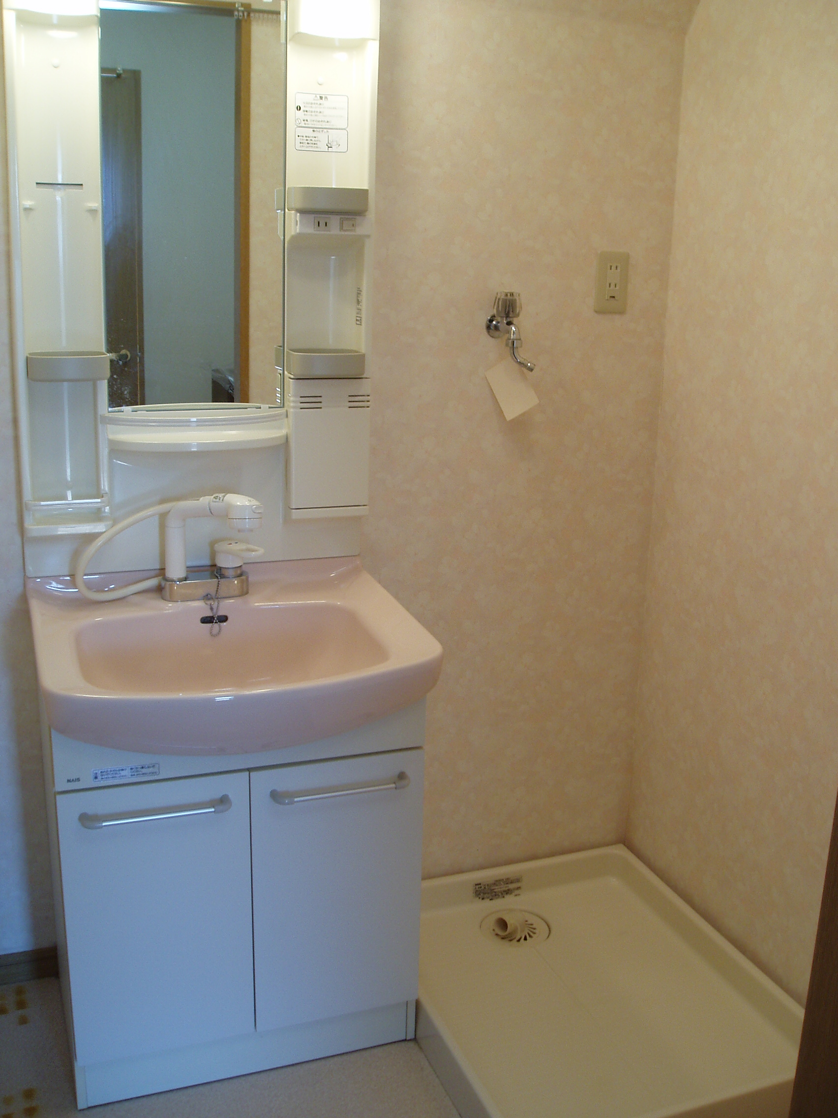 Washroom. There is storage room washing machine