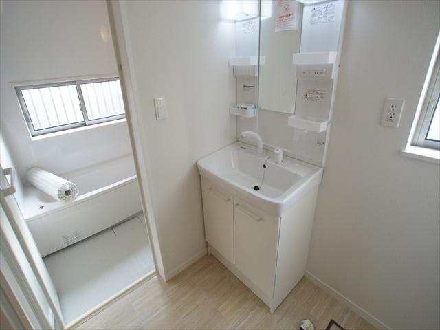 Wash basin, toilet. Vanity with happy shower in the morning