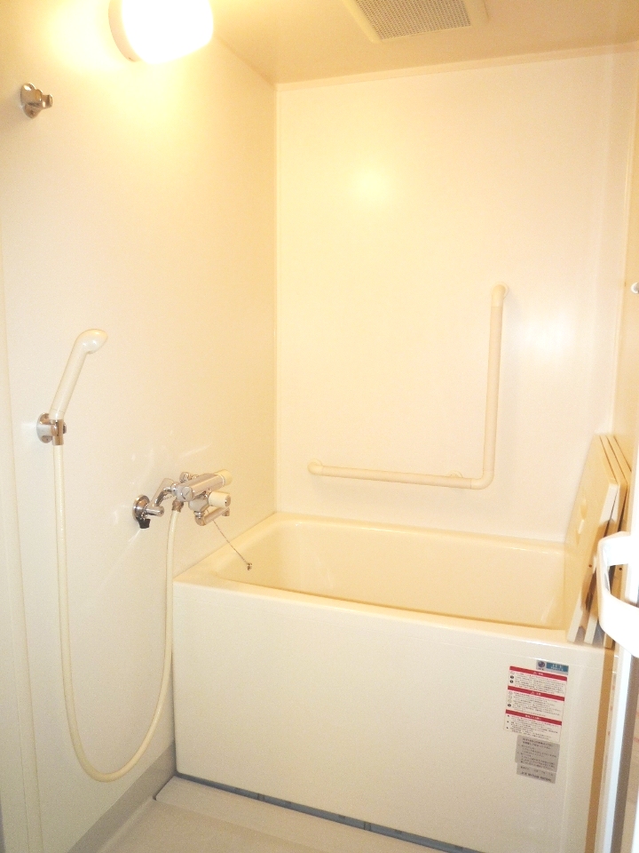 Bath. Bathing with a handrail