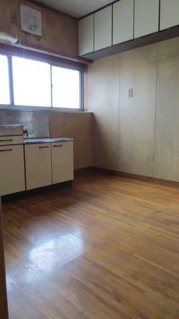 Kitchen. The window is large, bright kitchen.