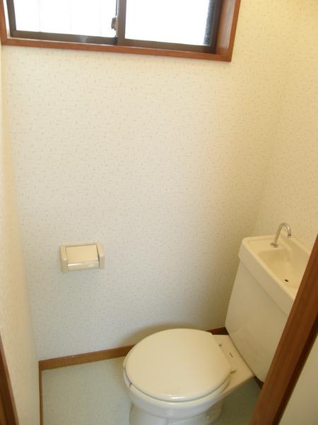 Toilet. Bright toilet there is a window