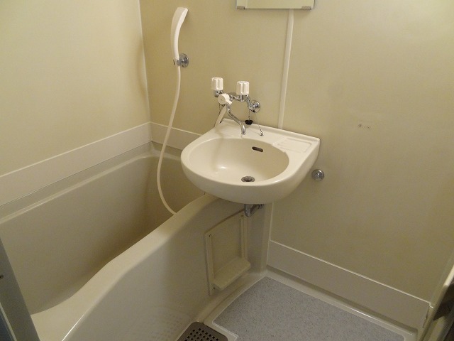 Bath. Bus toilet by, 