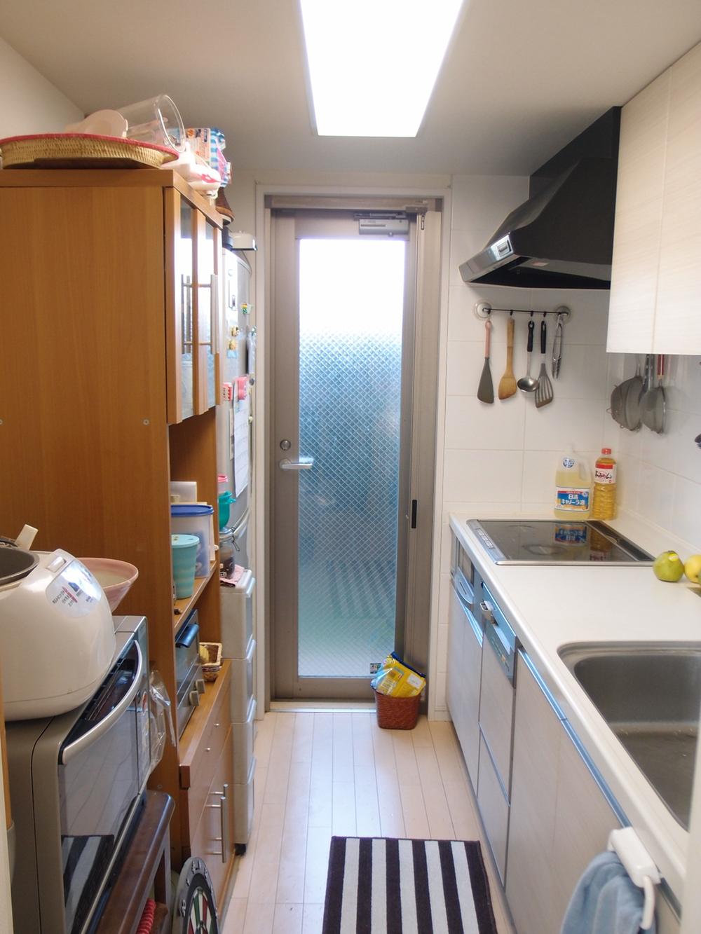 Kitchen. There is opening to the balcony