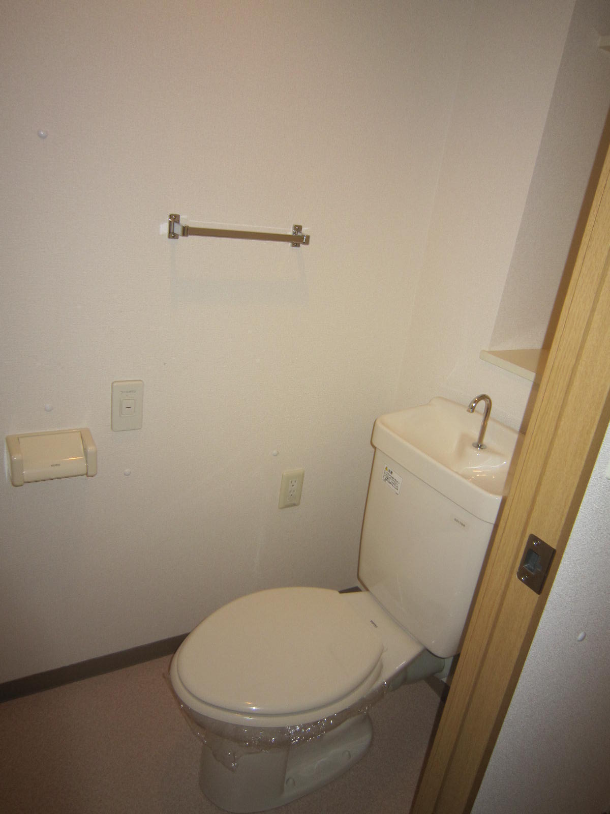 Toilet. With towel hanger