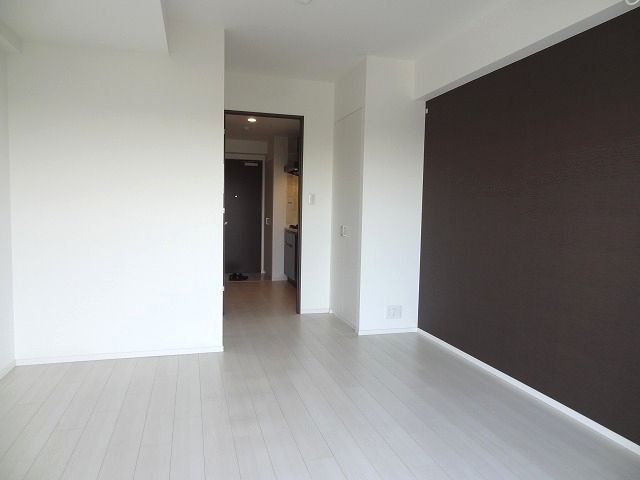 Living and room. It is brightly decorated and there is a sharp. Floor flooring