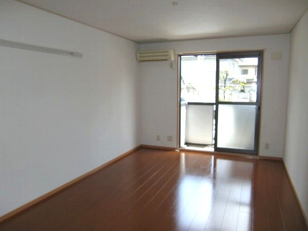 Living and room. There is air conditioning & shutters shutters