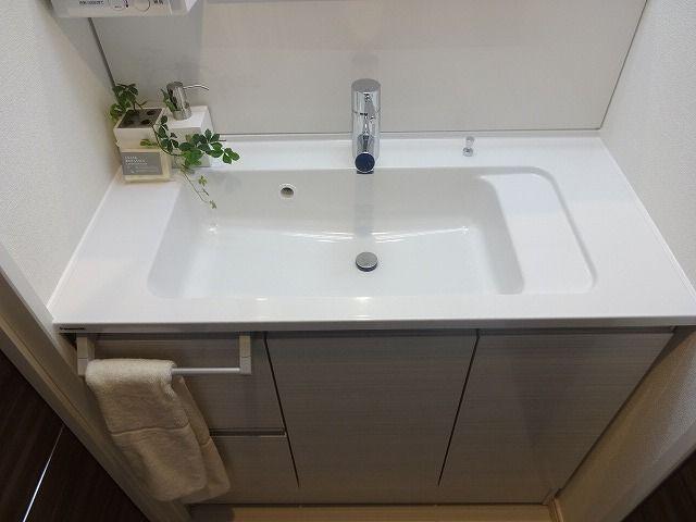 Wash basin, toilet. Bathroom vanity