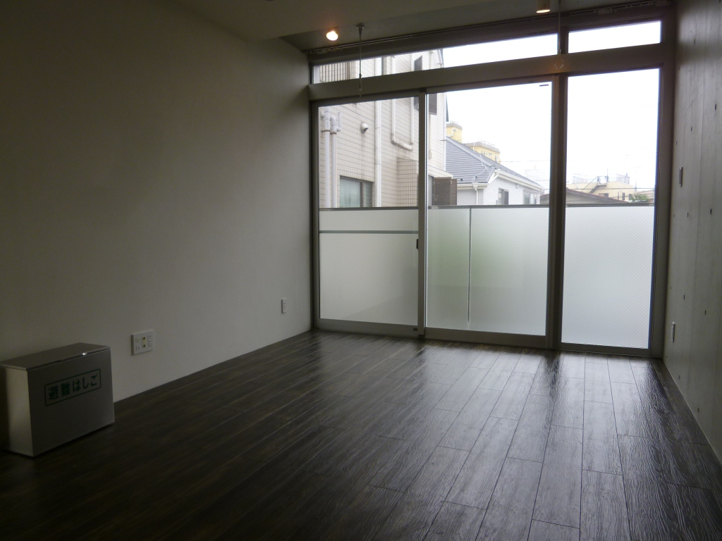 Living and room. It is a photograph of the same type of room.